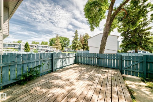 Private outdoor deck featuring wood planking and a perimeter fence - 3119 144 Avenue Nw, Edmonton, AB - Outdoor With Deck Patio Veranda With Exterior