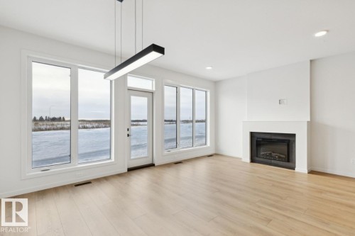7449 Klapstein Crescent Sw, Edmonton, AB - Indoor Photo Showing Living Room With Fireplace