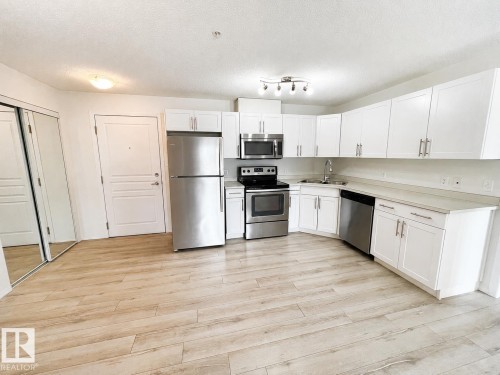 #244 301 Clareview Station Dr Nw, Edmonton, AB - Indoor Photo Showing Kitchen With Stainless Steel Kitchen With Double Sink