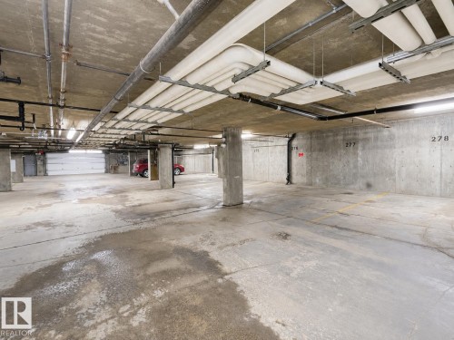 #244 301 Clareview Station Dr Nw, Edmonton, AB - Indoor Photo Showing Garage
