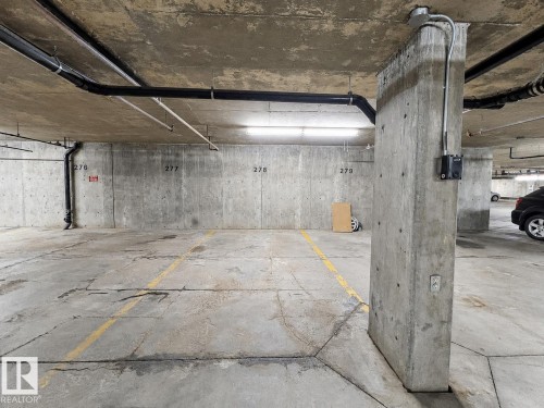 #244 301 Clareview Station Dr Nw, Edmonton, AB - Indoor Photo Showing Garage
