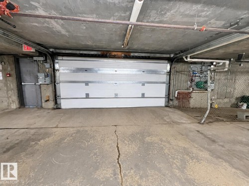 #244 301 Clareview Station Dr Nw, Edmonton, AB - Indoor Photo Showing Garage