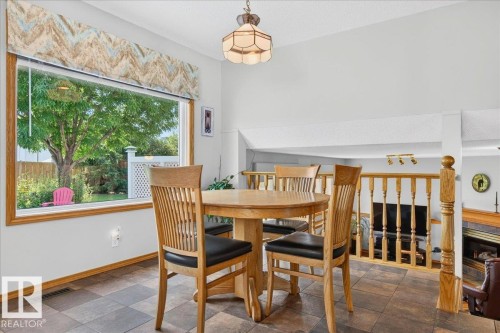 10 Westmews, Fort Saskatchewan, AB - Indoor Photo Showing Dining Room With Fireplace