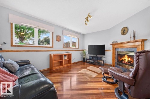 10 Westmews, Fort Saskatchewan, AB - Indoor Photo Showing Living Room With Fireplace
