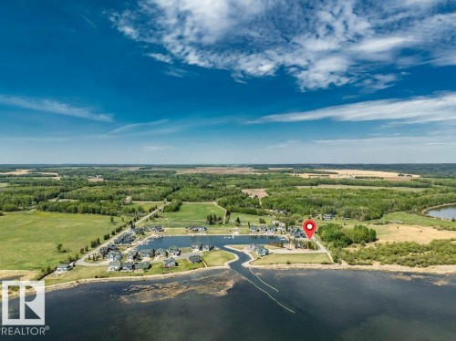 Aerial perspective showcasing a residential development with individual properties, a private marina - 12 Sunset Harbour, Rural Wetaskiwin County, AB 