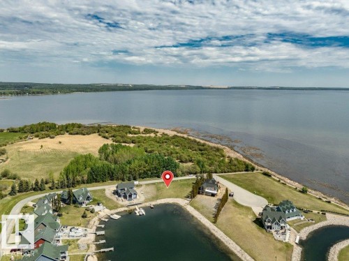 Waterfront property featuring extensive water frontage, a private marina - 12 Sunset Harbour, Rural Wetaskiwin County, AB 