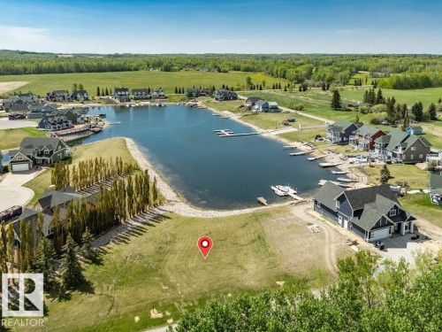Expansive lakeside property featuring a level building site, direct water frontage - 12 Sunset Harbour, Rural Wetaskiwin County, AB 