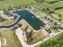 Aerial perspective showcasing a developed lakeside community a great waterfront building opportunity - 12 Sunset Harbour, Rural Wetaskiwin County, AB 