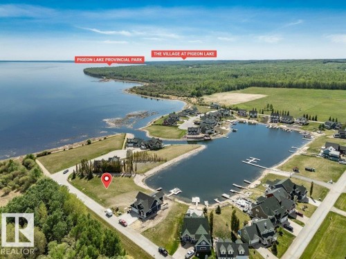 Aerial overview showcasing a waterfront opportunity with direct lake access - 12 Sunset Harbour, Rural Wetaskiwin County, AB 