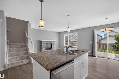1107 162 Street Sw, Edmonton, AB - Indoor Photo Showing Kitchen With Fireplace With Double Sink
