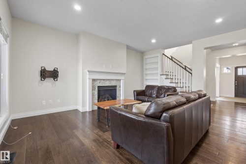 6311 Mann Place Nw, Edmonton, AB - Indoor Photo Showing Living Room With Fireplace