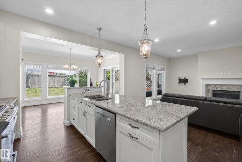 6311 Mann Place Nw, Edmonton, AB - Indoor Photo Showing Kitchen With Fireplace With Double Sink With Upgraded Kitchen