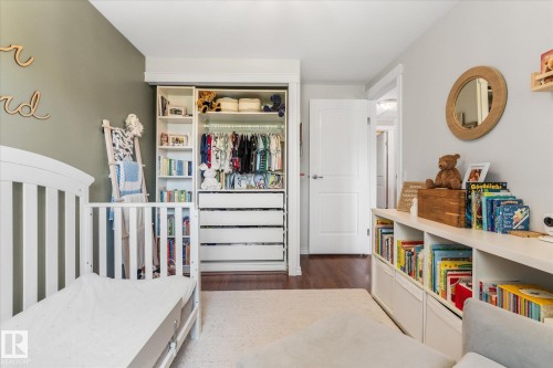Built-in closet system featuring shelving and drawers - 4718 35 Avenue Nw, Edmonton, AB - Indoor Photo Showing Other Room