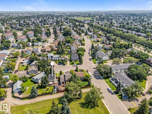 Aerial view of an established residential neighborhood featuring mature trees and a mix of single-family homes and multi-family residences - 4718 35 Avenue Nw, Edmonton, AB - Outdoor With View