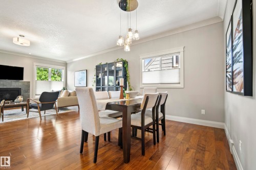 9844 75 Avenue Nw, Edmonton, AB - Indoor Photo Showing Dining Room With Fireplace