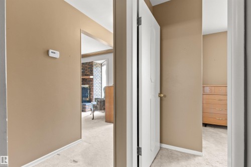 Neutral-toned walls and plush carpet flooring throughout - 12316 135 Avenue Nw, Edmonton, AB - Indoor Photo Showing Other Room