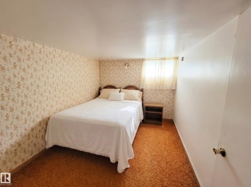 These photos are virtually decluttered to illustrate the clean, open space available to you once the current items are removed - 11405 97 Street Nw, Edmonton, AB - Indoor Photo Showing Bedroom