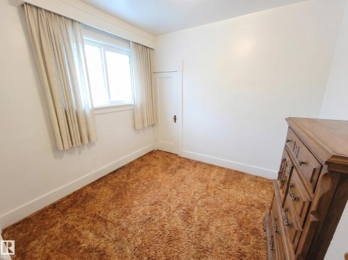 These photos are virtually decluttered to illustrate the clean, open space available to you once the current items are removed - 11405 97 Street Nw, Edmonton, AB - Indoor Photo Showing Other Room