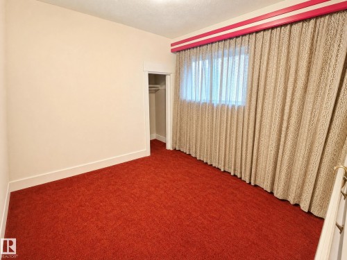 These photos are virtually decluttered to illustrate the clean, open space available to you once the current items are removed - 11405 97 Street Nw, Edmonton, AB - Indoor Photo Showing Other Room