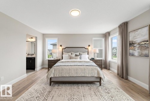 Spacious room featuring wood-finish flooring, light gray wall paint, and multiple windows with white blinds - 1663 Rutherford Road Sw, Edmonton, AB - Indoor Photo Showing Bedroom