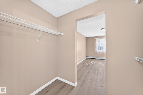 Closet space featuring a white wire shelving system - #317 245 Edwards Dr Sw, Edmonton, AB - Indoor With Storage