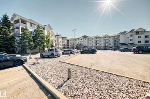 Multi-story residential buildings featuring white exteriors and balconies - #317 245 Edwards Dr Sw, Edmonton, AB - Outdoor