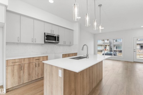 107 Sereno Lane, Fort Saskatchewan, AB - Indoor Photo Showing Kitchen With Double Sink
