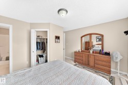 Bedroom featuring neutral wall paint, white ceiling, and a flush mount light fixture - 