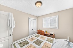 Neutral-toned walls complement the textured ceiling - 
