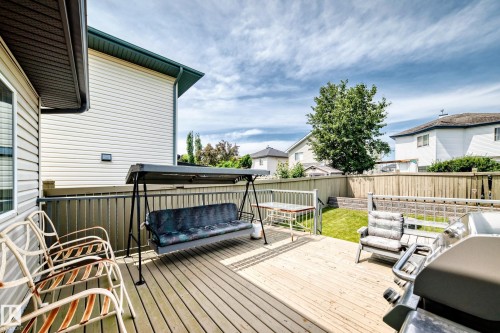 Spacious wooden deck with slatted railing - 3226 30 Avenue Nw, Edmonton, AB - Outdoor With Deck Patio Veranda With Exterior