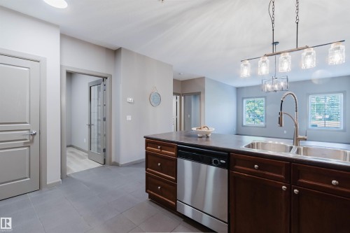 #106 160 Magrath Rd Nw, Edmonton, AB - Indoor Photo Showing Kitchen With Double Sink