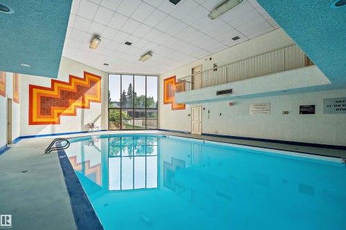 #315 5520 Riverbend Rd Nw, Edmonton, AB - Indoor Photo Showing Other Room With In Ground Pool