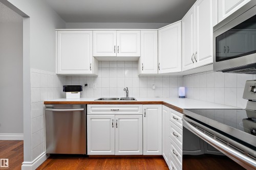#315 5520 Riverbend Rd Nw, Edmonton, AB - Indoor Photo Showing Kitchen With Double Sink