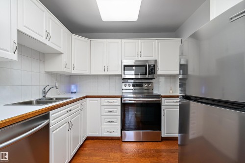 #315 5520 Riverbend Rd Nw, Edmonton, AB - Indoor Photo Showing Kitchen With Double Sink