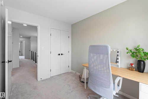 Spacious room featuring light gray wall paint and light gray carpeting - 8047 227 Street Nw, Edmonton, AB - Indoor Photo Showing Office