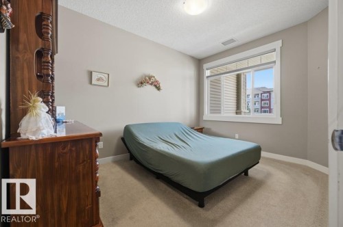 #205 511 Queen St, Spruce Grove, AB - Indoor Photo Showing Bedroom