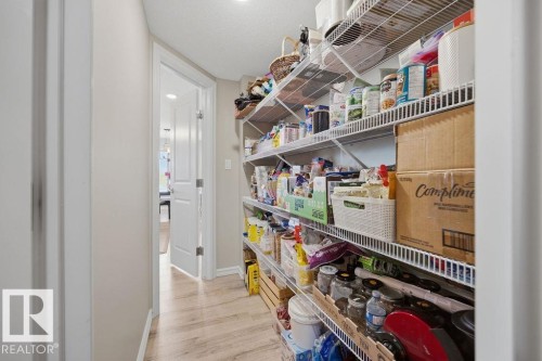 Walk through pantry from mudroom to kitchen - 5806 66 Street, Beaumont, AB - Indoor Photo Showing Other Room