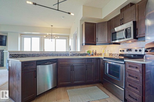 #703 10303 111 St Nw, Edmonton, AB - Indoor Photo Showing Kitchen With Stainless Steel Kitchen With Upgraded Kitchen