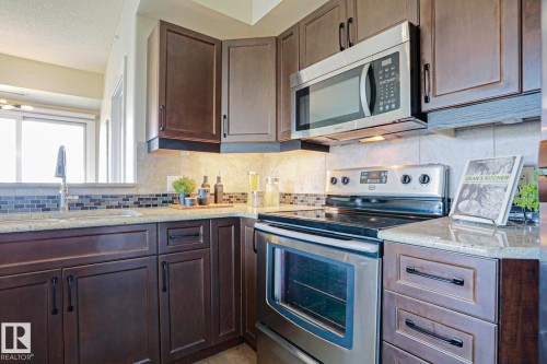 #703 10303 111 St Nw, Edmonton, AB - Indoor Photo Showing Kitchen With Stainless Steel Kitchen With Upgraded Kitchen