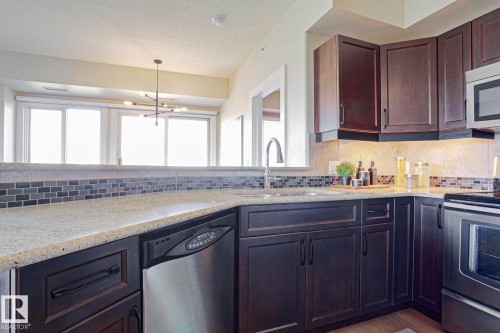 #703 10303 111 St Nw, Edmonton, AB - Indoor Photo Showing Kitchen With Stainless Steel Kitchen With Upgraded Kitchen