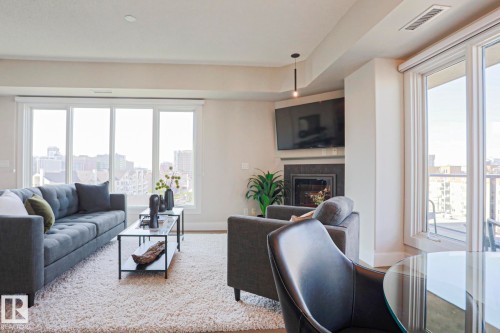 #703 10303 111 St Nw, Edmonton, AB - Indoor Photo Showing Living Room With Fireplace