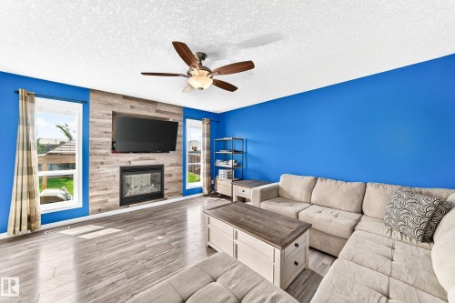 108 Houle Drive, Morinville, AB - Indoor Photo Showing Living Room With Fireplace