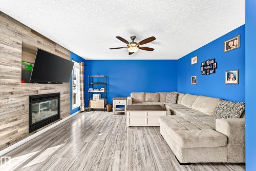 108 Houle Drive, Morinville, AB - Indoor Photo Showing Living Room With Fireplace