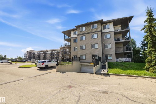 Multi-story residential building with private balconies and a sloped roofline - #143 301 Clareview Station Dr Nw, Edmonton, AB - Outdoor With Facade