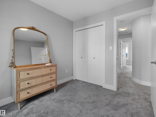 Carpeted room with light gray wall paint and white trim - #81 6905 25 Av Sw, Edmonton, AB - Indoor
