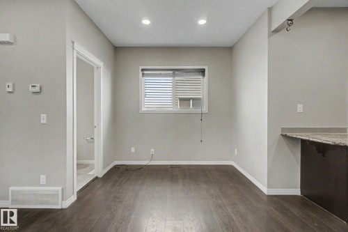 Open concept living space featuring wood-finish flooring, recessed lighting, and neutral wall tones - 315 Watt Boulevard Sw, Edmonton, AB 