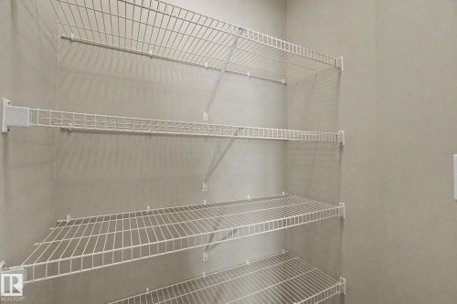White wire shelving system - 315 Watt Boulevard Sw, Edmonton, AB 