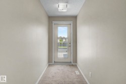 Rear exterior door with full glass panel and an interior transom window - 