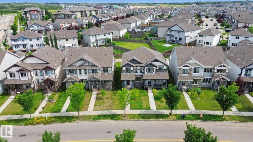 Row of residential properties featuring varied architectural styles and asphalt shingle roofs - 315 Watt Boulevard Sw, Edmonton, AB 