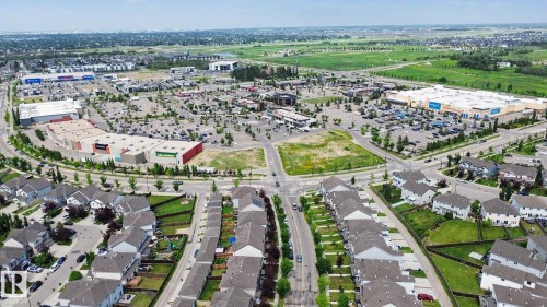 Aerial perspective showcasing a residential community with numerous single-family homes and townhomes - 315 Watt Boulevard Sw, Edmonton, AB 